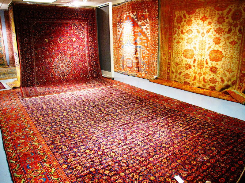 Rich red classic oriental and Persian rugs on display in Bonhams & Butterfields