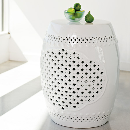 White porcelain ceramic accent table with quatrefoil motif from West Elm
