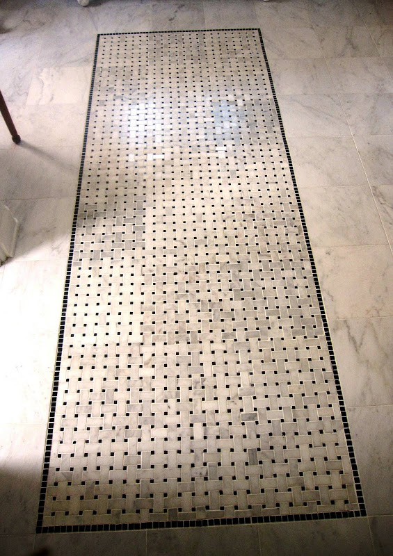 marble basketweave black and white tile on the master bathroom floor