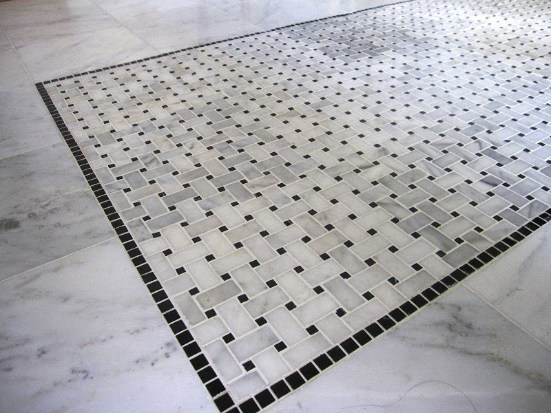 Detail of marble basketweave black and white tile on the master bathroom floor