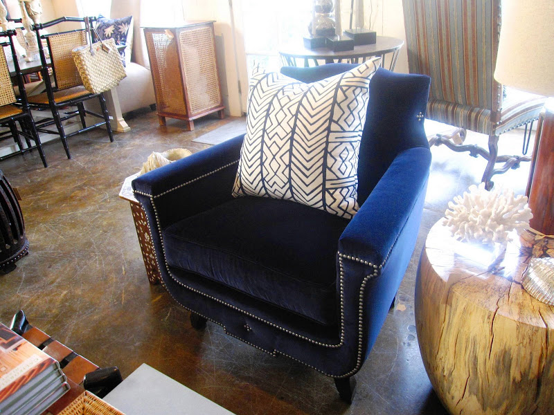 Dark blue velvet armchair with wood legs and pewter nailhead trim from Mecox Gardens