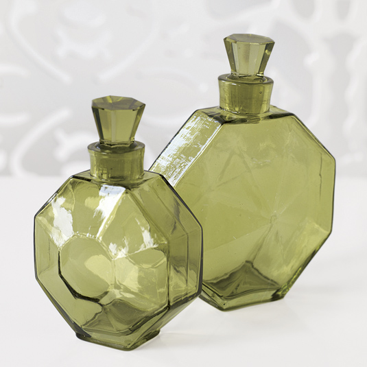 Two green glass decorative bottles with stoppers from Brocade Home