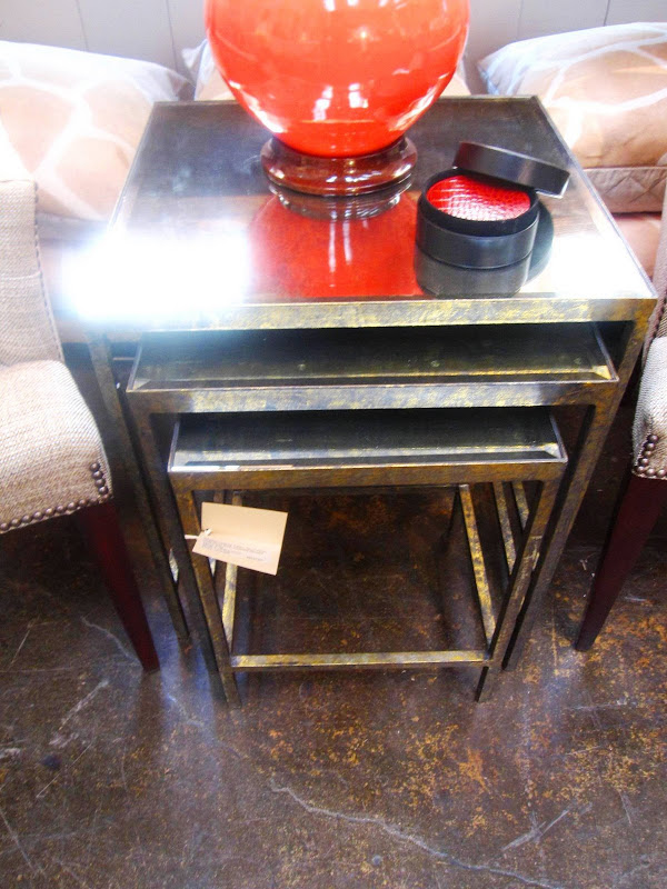 Set of three nesting table with a gold base at Mecox Garden