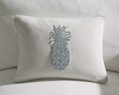 White linen pillow with a pineapple hand stitched in silver thread from William Sonoma Home