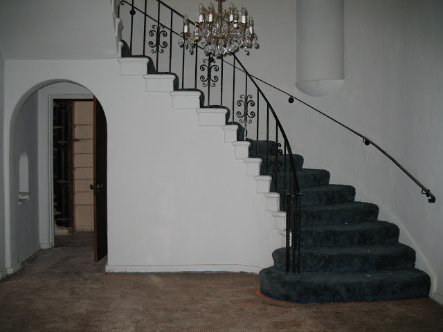 Entryway and main staircase in a Hancock Park home prior to remodeling