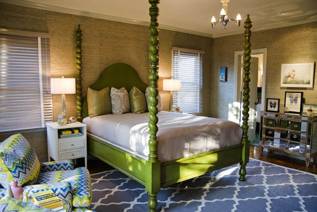 Guest bedroom in a Hancock Park home after remodeling with seagrass wallpaper, a green four poster bed and an arched window