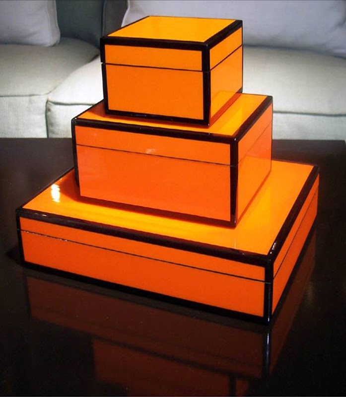 Three glossy orange lacquer boxes from Plantation 