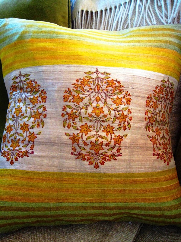 Close up of a striped yellow pillow in an living room in Venice Beach, CA