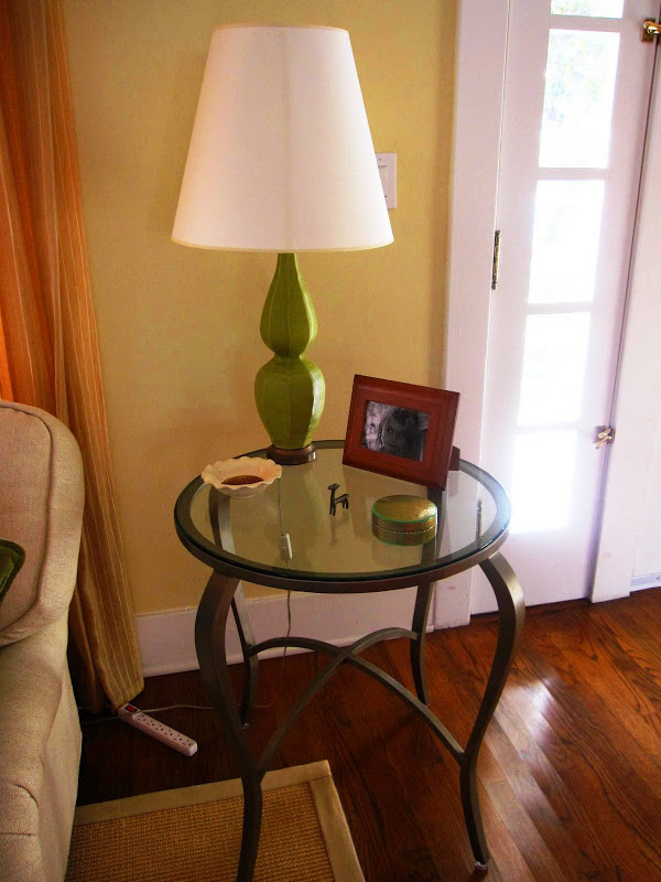 Metal and glass entry table with a green ceramic table lamp in a Venice Beach, CA home