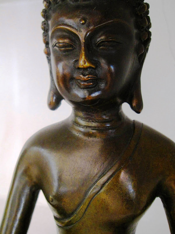 Close up of a bronze Buddha sculpture 