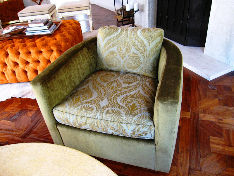 Avocado green armchair upholstered in solid green velvet and a peacock paisley fabric