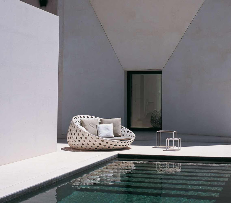 Round armchair from B&B Italia by a pool