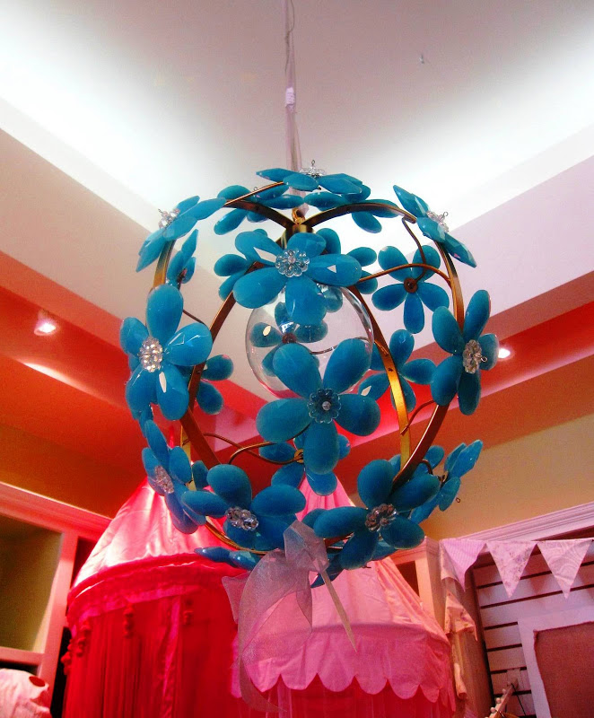 Round pendant light with turquoise blue crystals in the forms of flowers from Little House