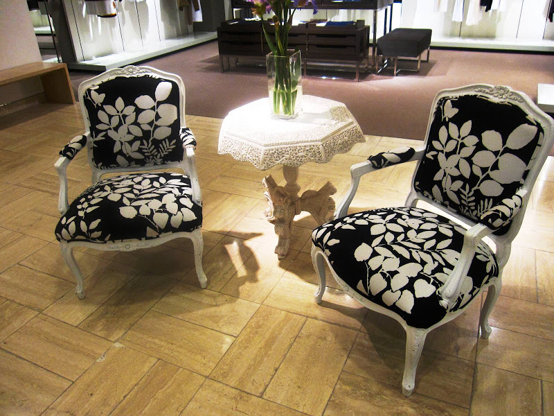 White lacquer Louis XV chairs with black and white floral upholstery in Neiman Marcus
