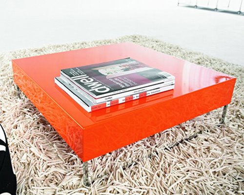 Large orange lacquer coffee table with steel legs from Modern Dose