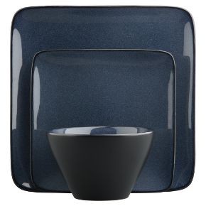 Deep indigo blue stoneware dishes with reactive glaze and matte black exteriors from cb2
