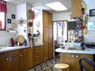 Outdated and cluttered kitchen before a remodel