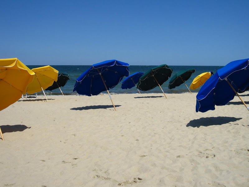 Blue, green and yellow umbrellas at the Cliffside Beach Club in Nantucket 