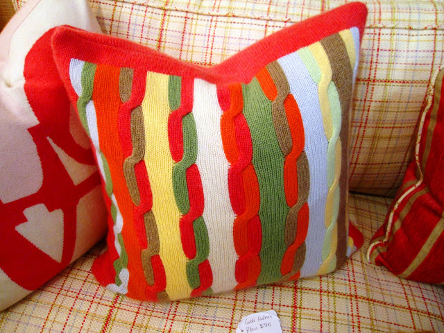 Multicolored cable knit cashmere throw pillow inside the Elizabeth Bauer store