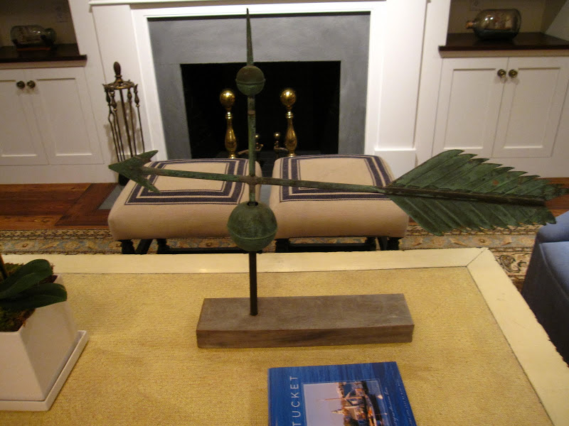 Weather vane mounted on a wood block on a coffee table at the Great Harbor Yacht Club