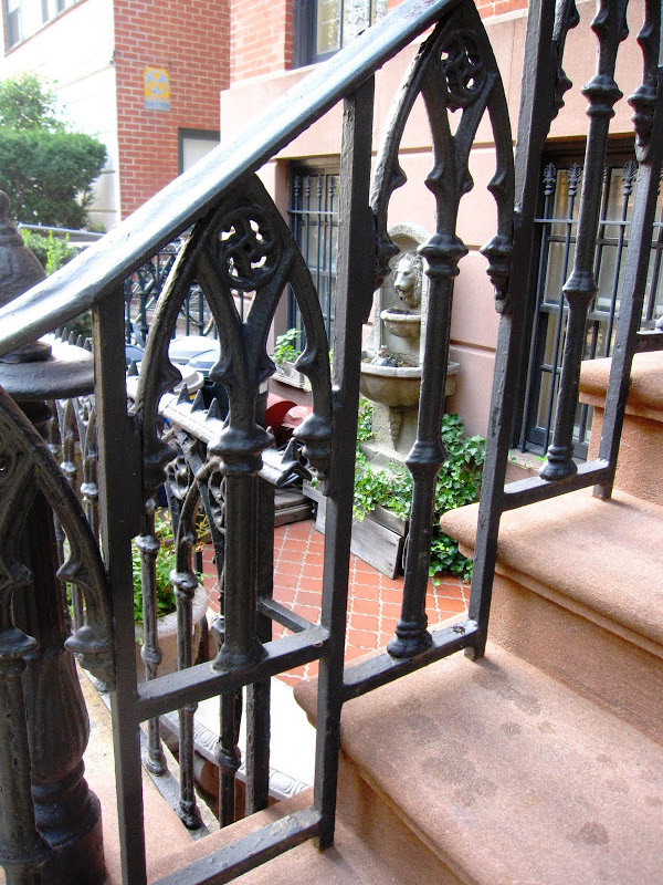 Beautiful iron railing on the stairs of a New York City Brownstone