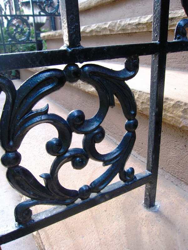 Close up of iron railing on the stairs of a New York City Brownstone