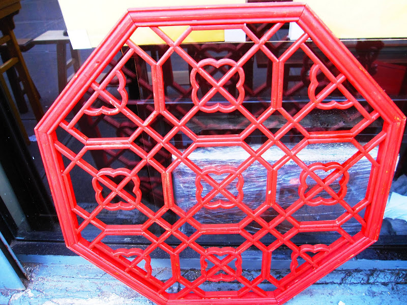Red chinoiserie octagonal wall hanging in New York City
