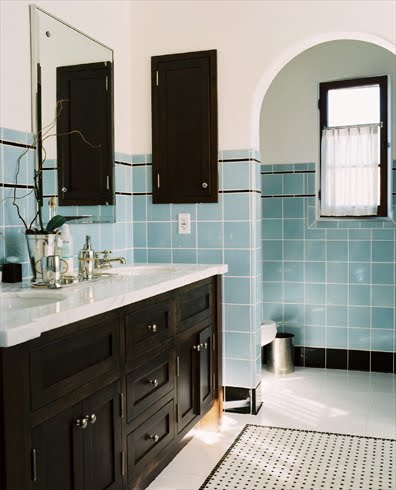 Los Angeles area bathroom with square ceramic tiles in blue and black trim, marble counter, black cabinets and drawers and base molding
