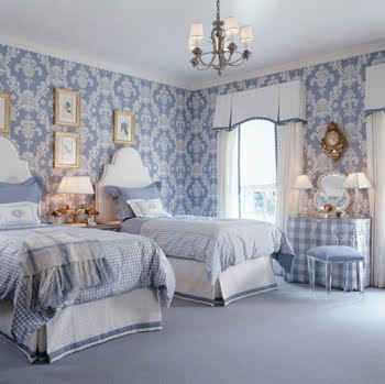 Blue and white bedroom with damask wallpaper, gingham bedding, white headboards, white curtains and bed skirts with blue trim and a girly vanity