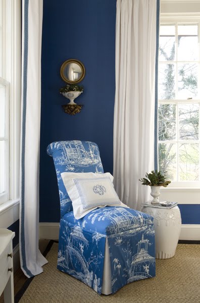 Bedroom by Kelley Proxmire with a white Chinese garden stool and a slipper chair with blue and white Chinoisserie toile upholstery 
