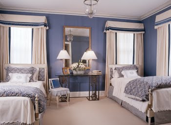 Symmetricla blue bedroom with two twin beds by Kelley Proxmire