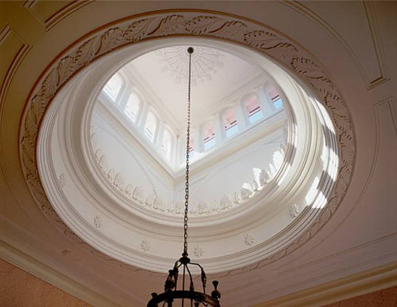 Foyer in a Virginia home by Peter Pennoyer with a dome ceiling with clerestory windows