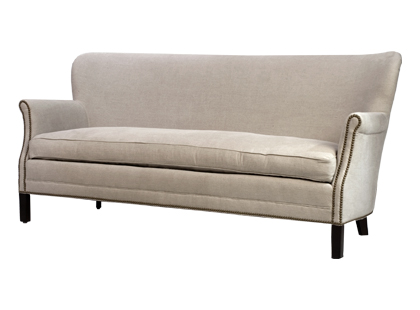 Sofa with antique brass nailhead trim detail on arms from Jayson Home & Garden