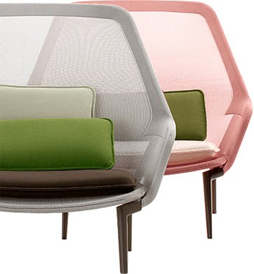 Two Slow chairs one in pink the other white both with two green accent pillows design Ronan & Erwan Bouroullec from Hive