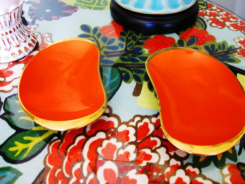 Two vintage orange kidney shaped decorative dishes
