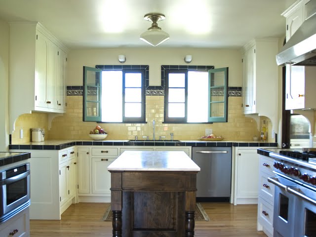Remodeled Deco kitchen in Los Angeles with butter yellow tiles counter, backsplash and period accessories