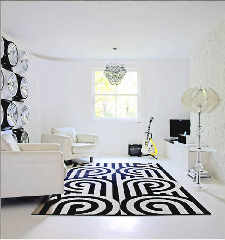 White living room with a graphic black and white rug from Knots Rug, Ltd