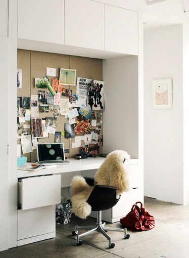 White modern home office with built in cabinets and drawers