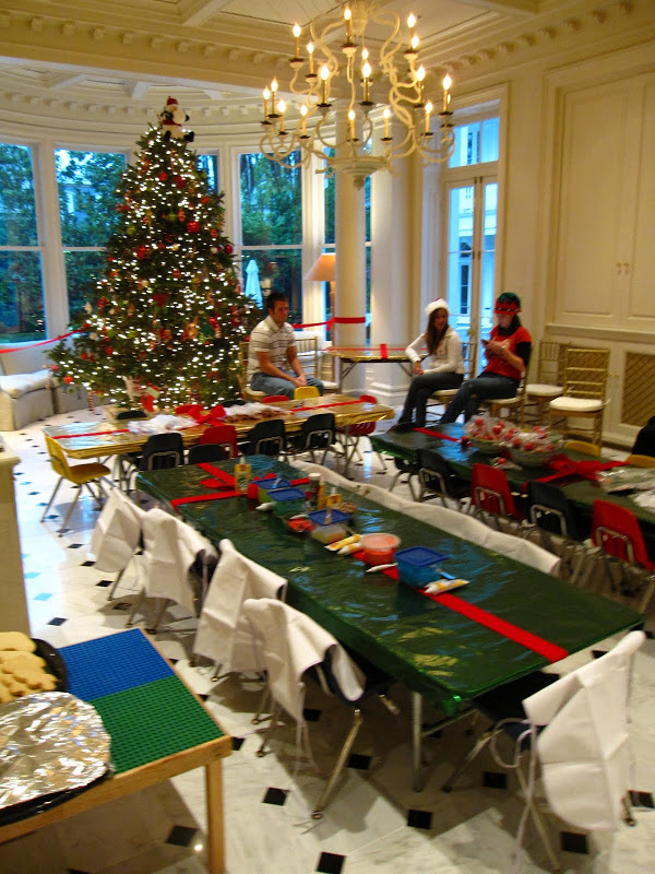  Garden Room of a historic New Orleans mansion with a large Christmas tree ready for children's party