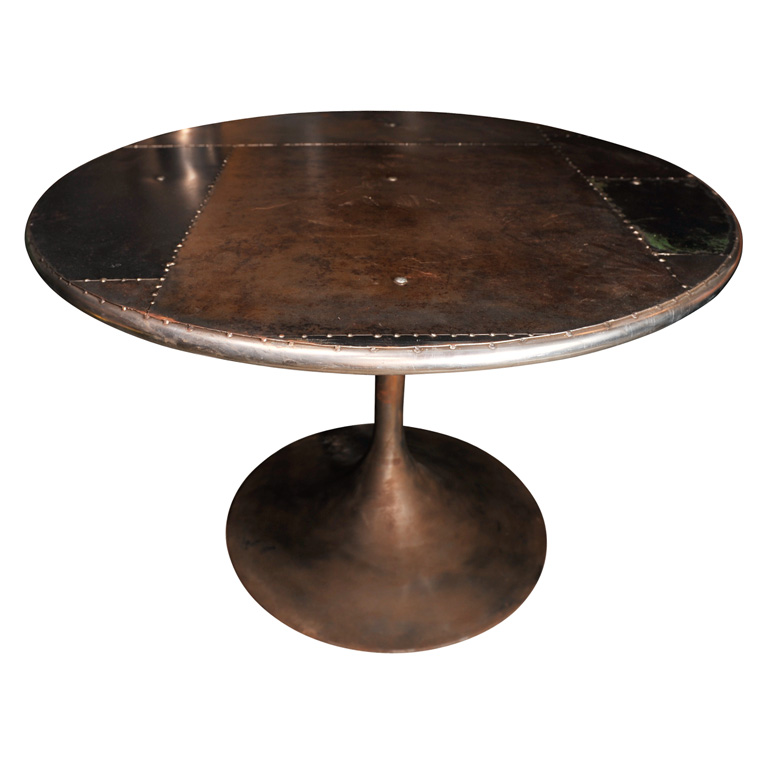 Round steel table with rivets from Mantiques Modern