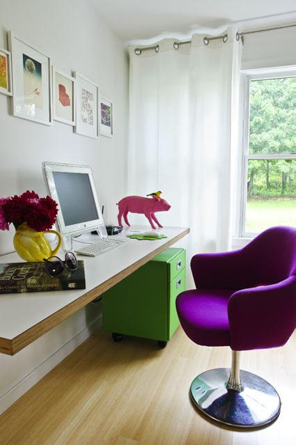Interior designer Ghislaine Vinas' small home office with a bright purple Saarinen chair, floating desk and a green cabinet