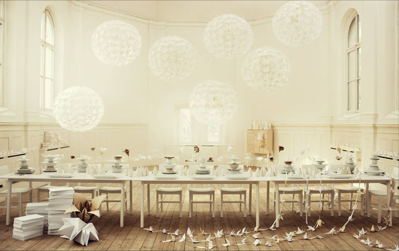 Dandelion ceiling lights in a dining room with paper decorations and accents