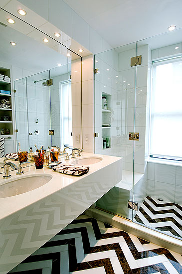 Bathroom with black and white chevron patterned tile floor
