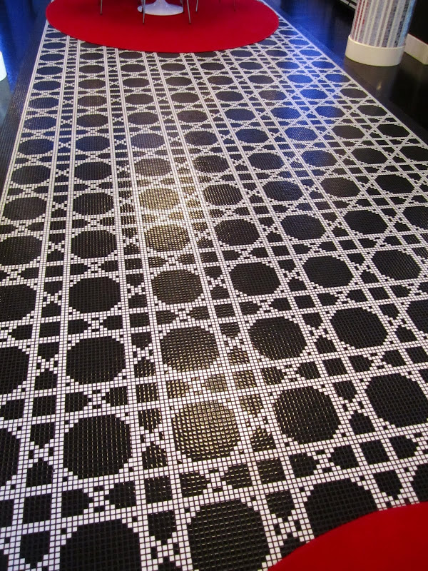Close up of the black and white cane mosaic tile floor