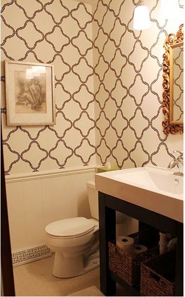 Bathroom with Sherwin-Williams easychange wallpaper and a gold vintage mirror