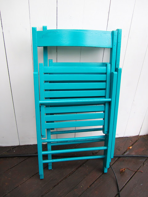 Wood folding chairs painted bright blue