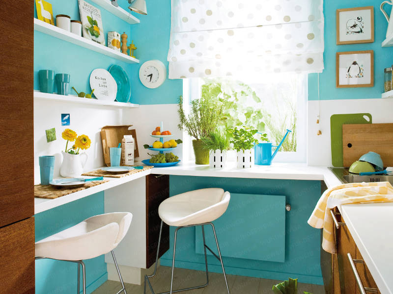 Small turquoise kitchen with floating shelves, wood cabinets and painted bar