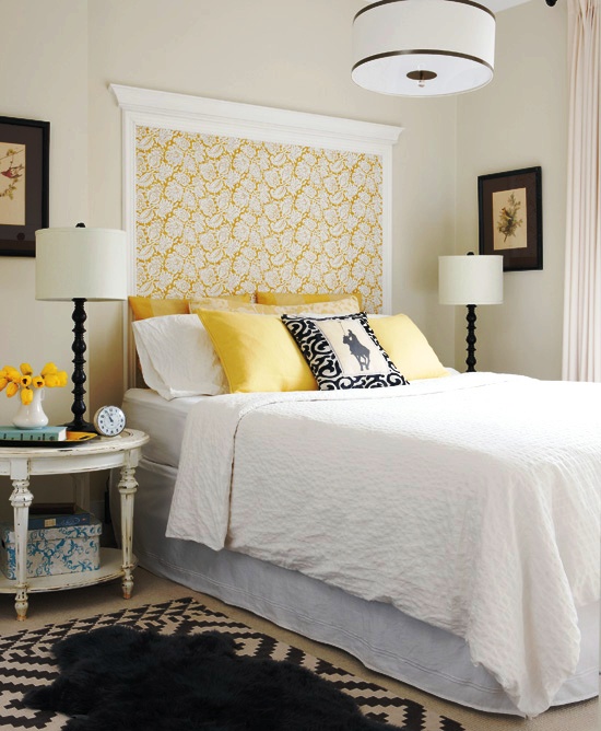 Master bedroom with black, white and yellow wall mounted "headboard" made of floral wallpaper and left over crown molding
