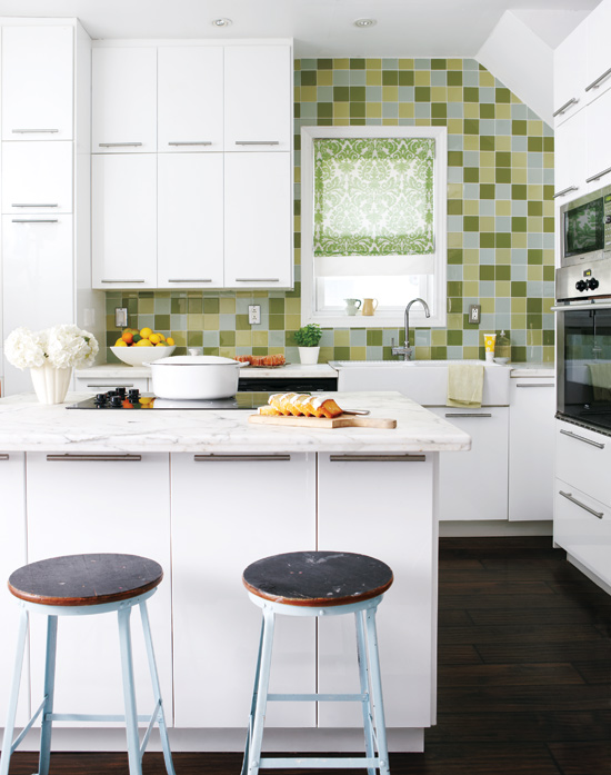 White kitchen with green and yellow square glass tile backsplash