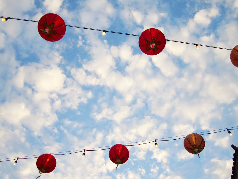 Blue sky with clouds and red hanging lanterns